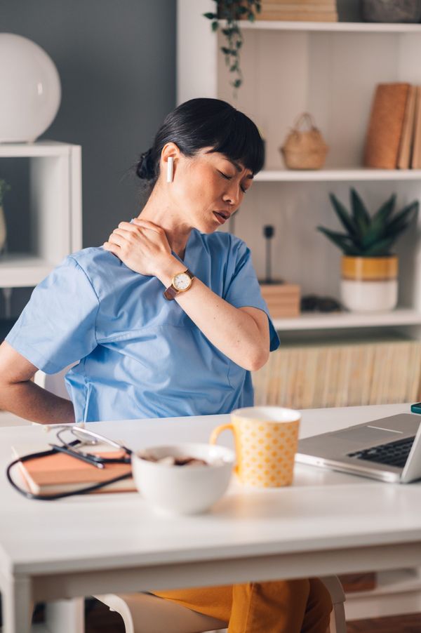 Person calmly considering a small bottle, representing personalized LDN treatment.