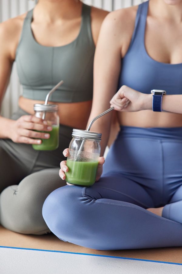 Hands holding a tablet showing metabolic health data